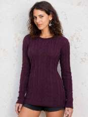Young woman wearing a long dark grape alpaca wool cable knit jumper, with a soft close fit, model Zora.